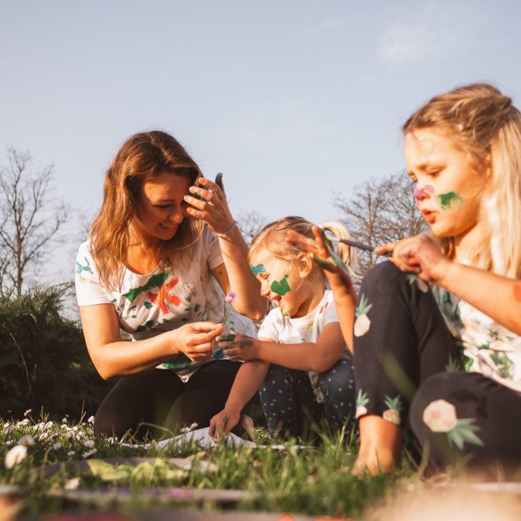 A,Joyful,Family,Outdoor,Painting,Session,Shows,Three,People,Engaging